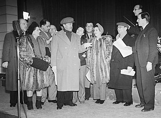 A group of performers in 1940s clothes, dressed warmly for a visit to northern Scotland