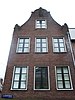 Huis vanwege de aanzetkrullen van de klokvormige top