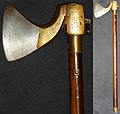 Indian (Southern) tabar (axe), 18th century, the wooden haft has a steel tang running 3/4 of the way down, pinned by four rivets. The axe head is brass with a forged steel blade, L. 58 cm.