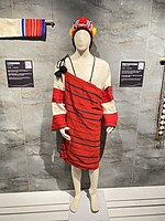 Female and male mannequins dressed in striped red clothes.