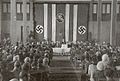 Die erste Sitzung des Weißruthenischen Zentralrat. Radaslau Astrouski spricht in der Mitte. 1944.