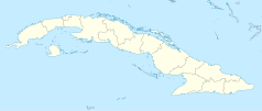 Mapa konturowa Kuby, w centrum znajduje się punkt z opisem „Trinidad de Cuba”