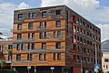 Das 2016 anstelle des Hallenbades errichtete Studentenwohnhaus „mine room“, ein Passivhaus in Holzbauweise[4]