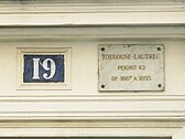 A plaque indicating Toulouse-Lautrec once lived in the building at 19 bis rue Pierre-Fontaine