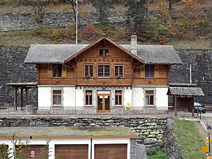 Two-story wooden building with gabled roof