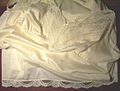 A folded cream-coloured Vassarette full slip