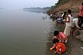 Rural celebrations on Diwali - floating diya over river Ganges