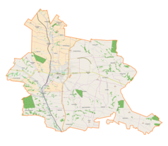 Mapa konturowa gminy Miechów, blisko centrum na lewo znajduje się punkt z opisem „Komorów”