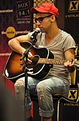 Jack Antonoff playing a guitar