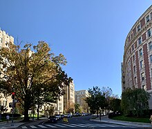 A photograph of a street with buildings on either side