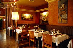 Several tables in the dining area.