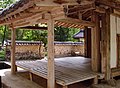 Dosan Seodang (lecture hall) featured on reverse of 1000 Won bill showing Jeonggu's hastily attached wooden planks