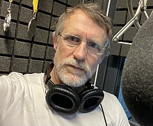 An image illustrating the audiobook narrator Matthew Lloyd Davis in his workspace