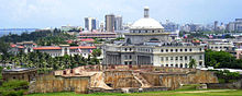 San Juan skyline, with a large, old white building in the foreground