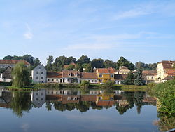 View across the pond in the centre of Uherčice