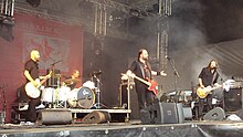 CMX performing at Suomi Pop festival, Jyväskylä, Finland, July 23, 2011. (L-R) Timo Rasio, Tuomas Peippo, A. W. Yrjänä, Janne Halmkrona.