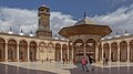 The courtyard (sahn) of the mosque, with the fountain (center right) and the clock tower (center left) visible