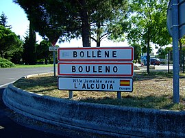 Entrance of Bollène. The second sign shows the town name in Provençal. The third one its twin town.