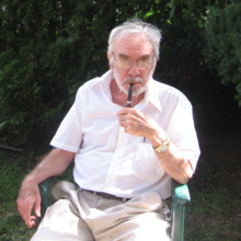 Professor Benson enjoying a pipe in his front yard, summer 2005.