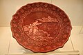 A red lacquerware plate, dated to the Qianlong Emperor's reign