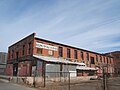 Warehouse that no longer exists which stood just west of the Jack Kerouac Lofts.