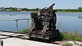 Rail-mounted winch atop diversion dam