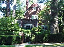 Larger, two-story house in leafy setting