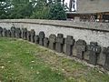 Grabkreuze aus Basaltlava an der Kirche