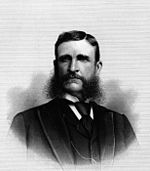 Upper-body portrait of a late-nineteenth-century man in a suit.