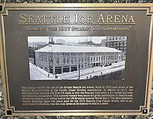 Plaque, titled "Seattle Ice Arena." Subtitled "Home of the 1917 Stanley Cup Champions." Centers with a picture of the former arena. Caption saying "This plaque marks the site of the former Seattle Ice Arena, built in 1915 and home to the Seattle Metropolitans of the Pacific Coast Hockey Association. In March of 1917, the Metropolitans became the first US team to win the Stanley Cup after a 3-1 series win over the Montreal Canadiens, This historic victory was cause for great celebration in Seattle and across the nation, just weeks before the US formally entered World War I. The Metropolitans hosted Montreal again two years later for the 1919 Stanley Cup Finals, which, due to an outbreak of influenza, was the only series in its history to end in a draw."