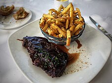 Steak frites prepared using flank steak, at a San Francisco restaurant