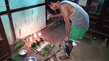 Hojai, the Dimasa Priest performing age old traditional ritual called Maiyaopa Garba