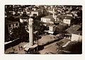 A view from the square in the 1920s. There are vendors at the base of the clock tower.