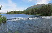 Utløpet til Rauma med demningen ved Dambrua