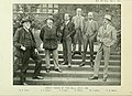 Sepia photograph of six gentlemen standing outside on pathway stairs