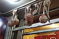 Leaves and balls of flower petals as nazar battu by a shop