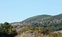 Curving mountain/hill landscape with a detailess sky