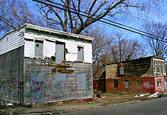 Urban blight on two abandoned houses not far from the Armory.