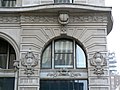 Architectural facade above the second floor, northeast corner of building.