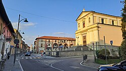 The main street of the comune with Ss. Alexander and Martin parish church (XIII c.) and the Curt dal Sacrista historical house (XVIII c.)