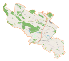 Mapa konturowa gminy Chęciny, w centrum znajduje się punkt z opisem „Podzamcze”