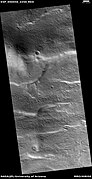 Wide view of surface with spots displaying mantle, as seen by HiRISE under HiWish program Location is the Arcadia quadrangle.