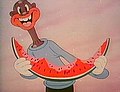 A character from the 1941 cartoon Scrub Me Mama with a Boogie Beat enjoying a watermelon.