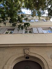 View of the exterior facade of the Hegel House above the entrance.