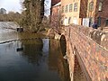 Confluence of River Stour with River Severn in old industrial area of Stourport-on-Severn, Worcestershire. The Stour flows from beneath a bridge, to the right.