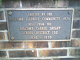 The plaque on the Centennial Bell