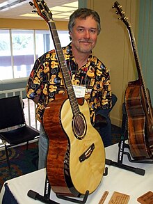 Kevin Ryan and his Nightingale model acoustic guitar.