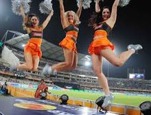 Cheerleaders cheering for SRH wearing team colours