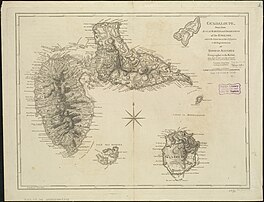 Beige paper with a hand drawn map of Guadeloupe with a compass rose in the middle. Basse-Terre and Grande-Terre are located to the north, with the smaller islands of Les Saintes, Marie-Galante, and Petite Terre to the south. The Marie-Galante Passage is labelled in French above Marie-Galante island, and below Petite Terre and Basse-Terre.