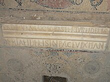 Marble inscription inserted in a mosaic